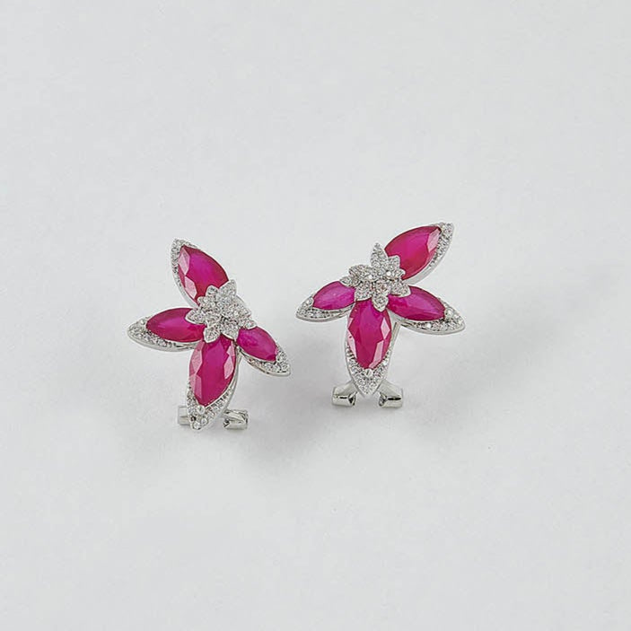 Pair of earrings with pink gemstones on a white background